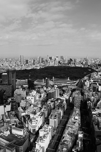 November 2, 2019 Shibuya Ward, Tokyo, Japan\nA view of Yoyogi Park and the skyscrapers of Shinjuku from the cityscape of Shibuya in downtown Tokyo