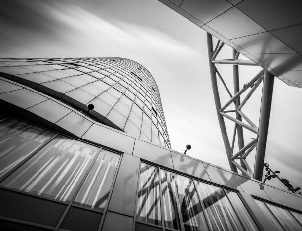 Birmingham, UK December 3rd 2020\n\nRotunda apartments and hotel building in city centre long exposure looking up to the sky black and white with dramatic moving clouds in sky