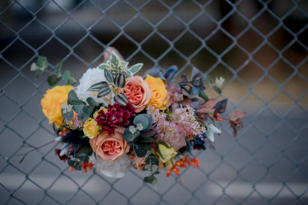 istock Flowers hanging in the fence 1300521855
