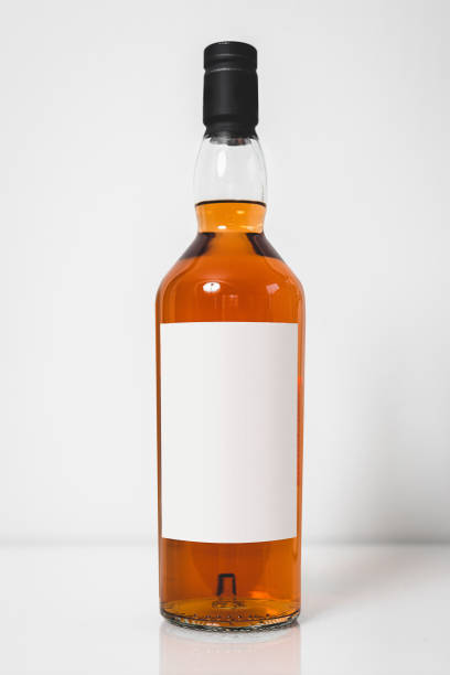 wiskey bottle template - brandy bottle alcohol studio shot imagens e fotografias de stock