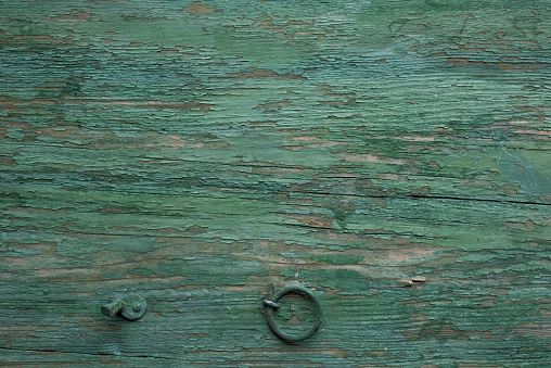 Old shabby green wood surface. Wooden textur background for decorations in country style. Top view photography.