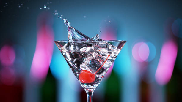 istock Closeup of splashing martini cocktail 1300522990