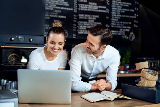 istock Cafe restaurant owners calculating bills. Small business concept. 1300523112