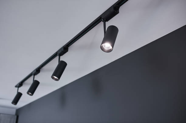 istock A group of hanging black metal lights. 1300523477