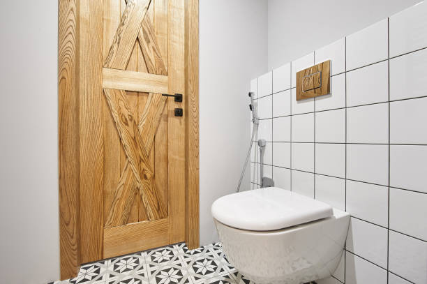 istock Modern flush toilet or WC in small bathroom with push button flush 1300523484
