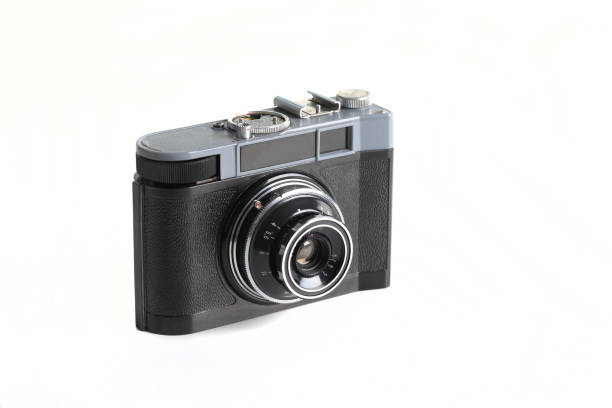 istock Old 35mm. scaling film camera on white background. 1300524825