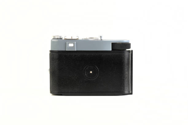 istock Old 35mm. scaling film camera on white background. 1300524831