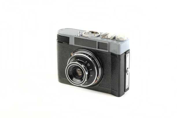 istock Old 35mm. scaling film camera on white background. 1300524832