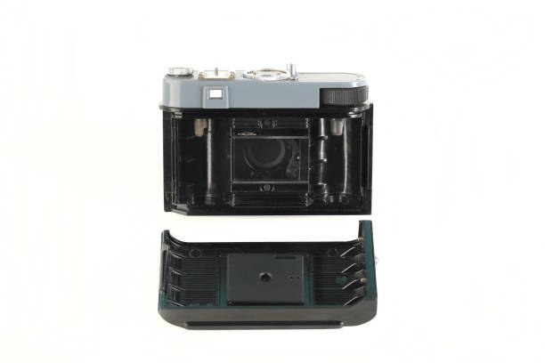 istock Old 35mm. scaling film camera on white background. 1300524833