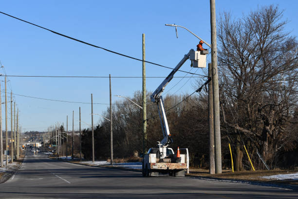 istock Electrician in a boom truck 1300525588