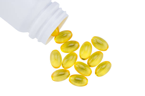 istock fish oil capsules isolated on white background. Omega 3 1300527118