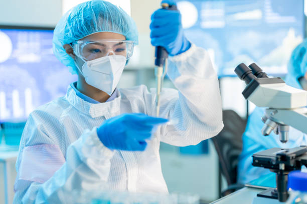 istock asian scientist take test tube 1300528767