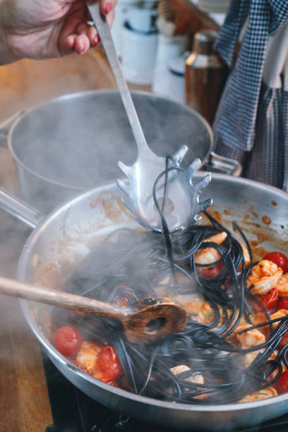 istock Spaghetti Nero Pasta with Shrimp Scampi and Cherry Tomato 1300529386