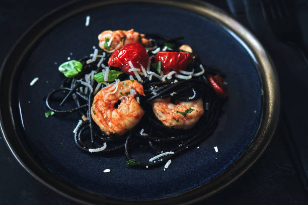 istock Spaghetti Nero Pasta with Shrimp Scampi and Cherry Tomato 1300529771