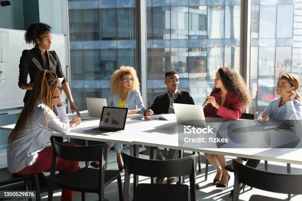 African American businesswoman head meeting with colleagues