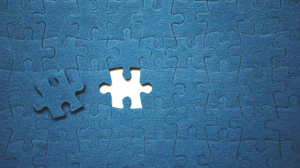 top view flat lay of jigsaw puzzle with one piece missing .concept of absence and incomplete.putting the last piece finding solution - teamwork absence blank jigsaw puzzle imagens e fotografias de stock