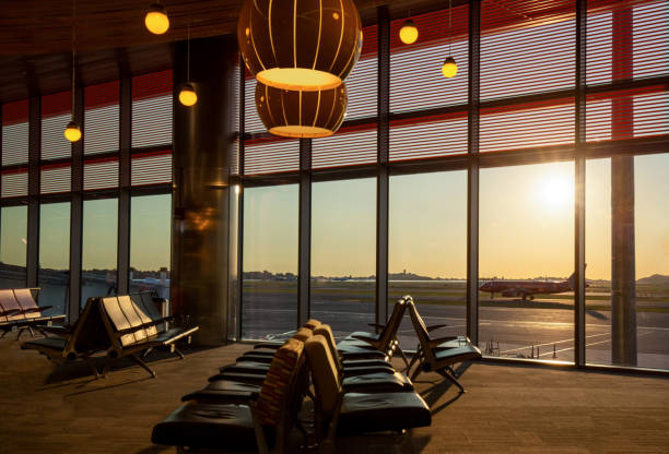 istock Boston Airport at sunset with planes getting ready for takeoff 1300532027