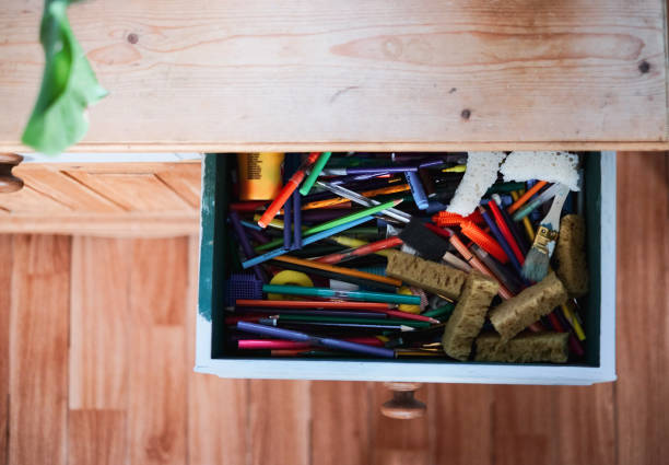 A messy drawer, full with drawing stuff