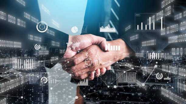 istock Imaginative visual business handshake with computer graphic of investment data 1300533455