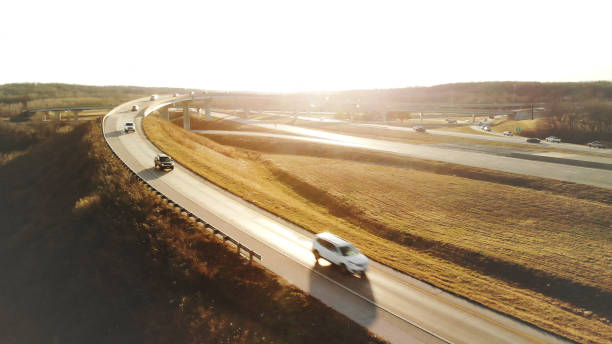 Eight Cars on Off Ramp Aerial Flyover Overpass Traffic View in Midwest USA Highway Transportation Photo Series Rush Hour Suburban Highway Traffic Aerial Flyover Overpass Traffic View in Midwest USA Highway Transportation Photo Series Matching Video Available (Shot with DJI Mavic Air photos professionally retouched - Lightroom / Photoshop) city zoom out stock pictures, royalty-free photos & images