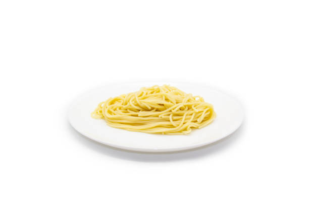 istock The pasta on the white plate in the white background. Spaghetti on the plate. 1300534403