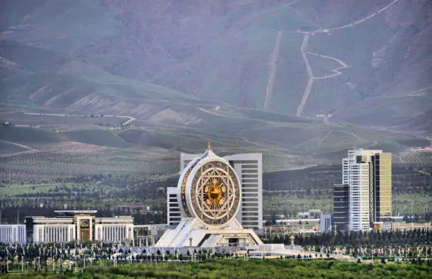 Photo of Ashgabat, Turkmenistan - skyline of the Archabil avenue government district and mountains