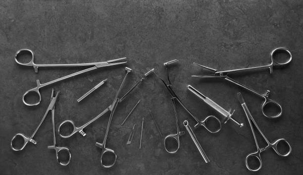 istock Piercing earrings, stainless steel clips for disinfection on a black background 1300535611