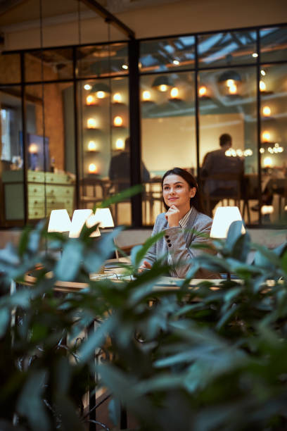 istock Dreamy young woman thinking about career development 1300537019