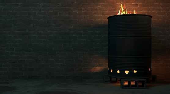 3d illustration. Brick wall of a street facade at night. Burning barrel hearth in the gateway of the slums