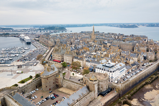 Saint-Malo, France - June 03 2020: Aerial view of the old town of Saint-Malo surrounded by ramparts with the Castle of the Duchess Anne, the Quic-en-Groigne Tower and the cathedral.