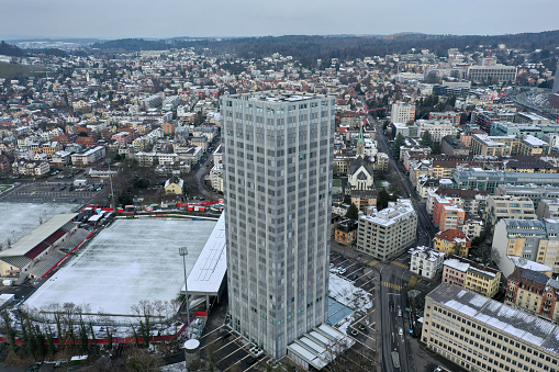 The Sulzer Hochhaus (Tower) was built between 1962 and 1966. The Tower was planed by the architects Suter & Suter. With its 99.7 meters its still the tallest building in Winterthur. The high angle image was captured during winter season after som snowfall.