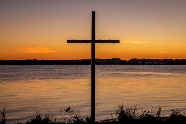 istock Cross Silhouette on Florida Riverbank 1300545628