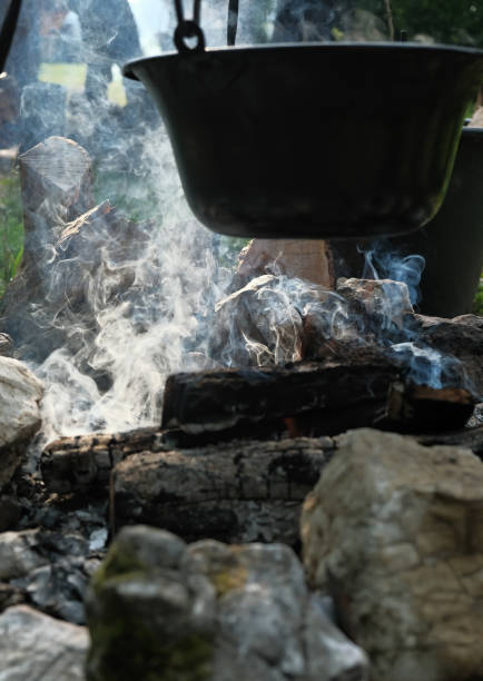 Vertical shot of a cauldron on fire stock photo