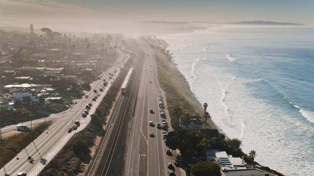 istock Passenger Train and US 101 Running Through Encinitas, CA - Aerial 1300550813