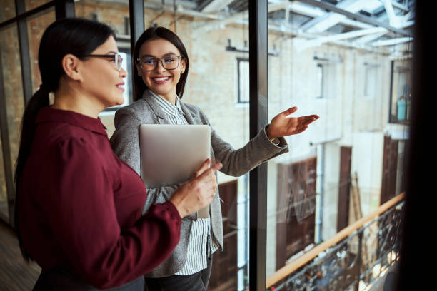 istock Positive delighted brunette pointing at big hall 1300552432
