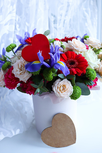 Happy Valentine's Day greeting card. beautiful bouquet of flowers and red heart