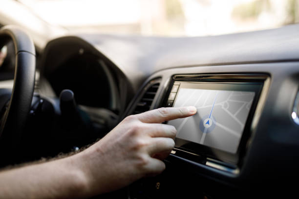 istock Person checking directions at the car media player 1300554392