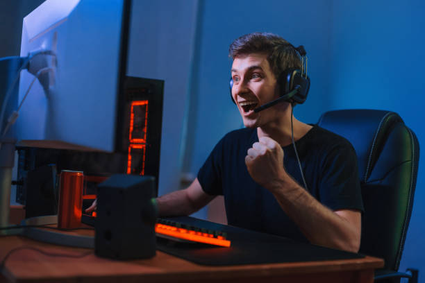 istock Young pro gamer is exited with winning online video game 1300554805