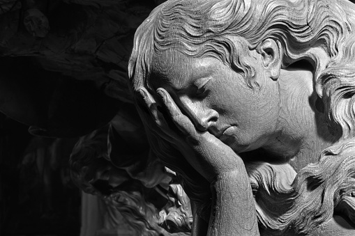 Mechelen - The Carved relief of cried angel in Onze-Lieve-Vrouw-va n-Hanswijkbasiliek church.