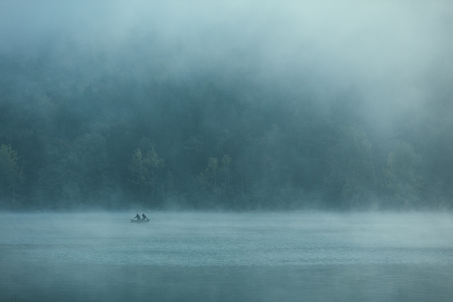 Photo of lake in the misty fog.