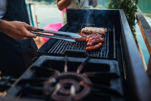 istock Couple barbecuing outdoors 1300555984