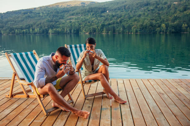 istock Lovely couple having lunch in beautiful natural environment 1300555989