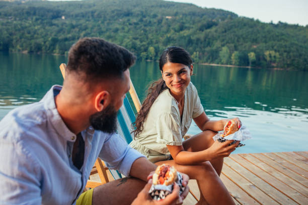 istock Lovely couple having lunch in beautiful natural environment 1300555992