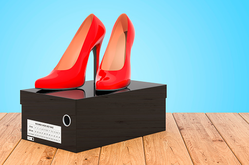 High heel shoes in the black shoebox on the wooden planks, 3D rendering