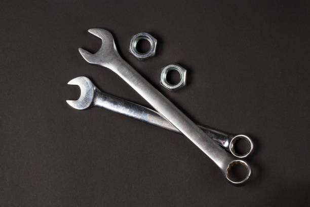 istock Set of two spanners on a Dark Textured Background 1300557086
