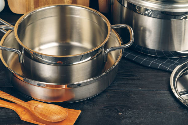 istock Set of stainless steel saucepans in a kitchen 1300557856