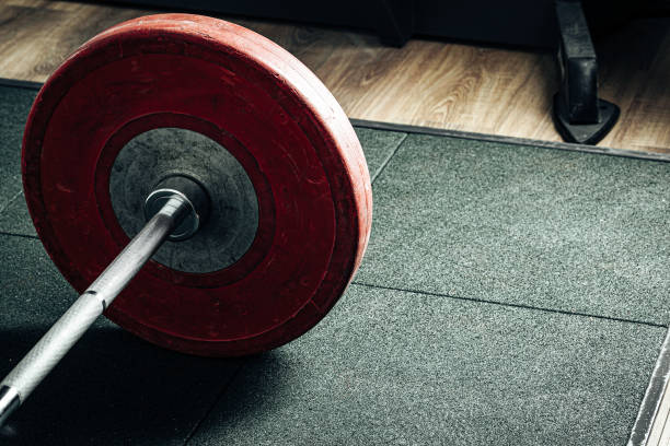 istock Weight plates in a gym, powerlifting equipment 1300558206