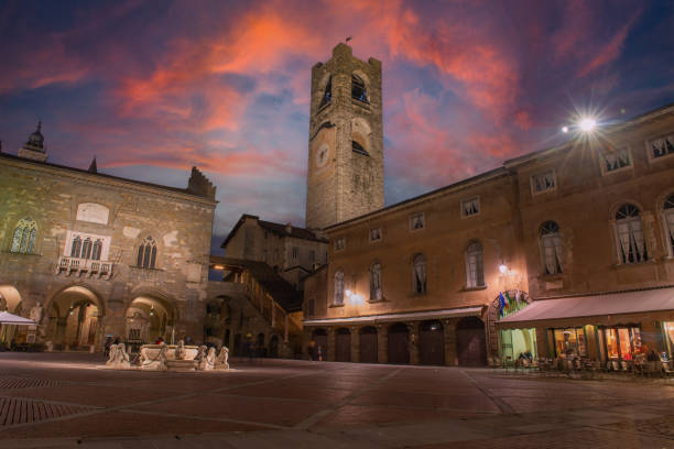 Bergamo's old square at dusk The old square in the center of the upper town of Bergamo bergamo stock pictures, royalty-free photos & images