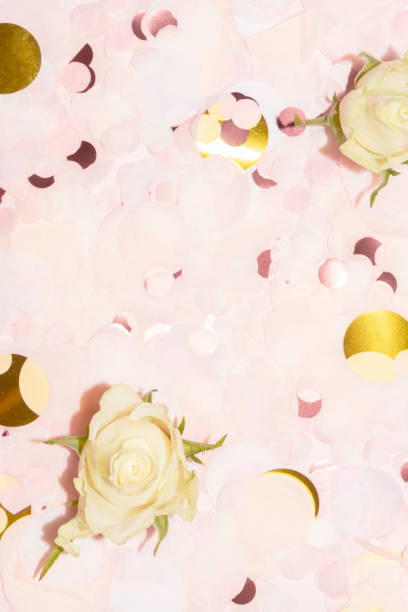 istock pink and gold paper confetti with roses 1300561706