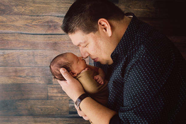 Father Holding Newborn stock photo